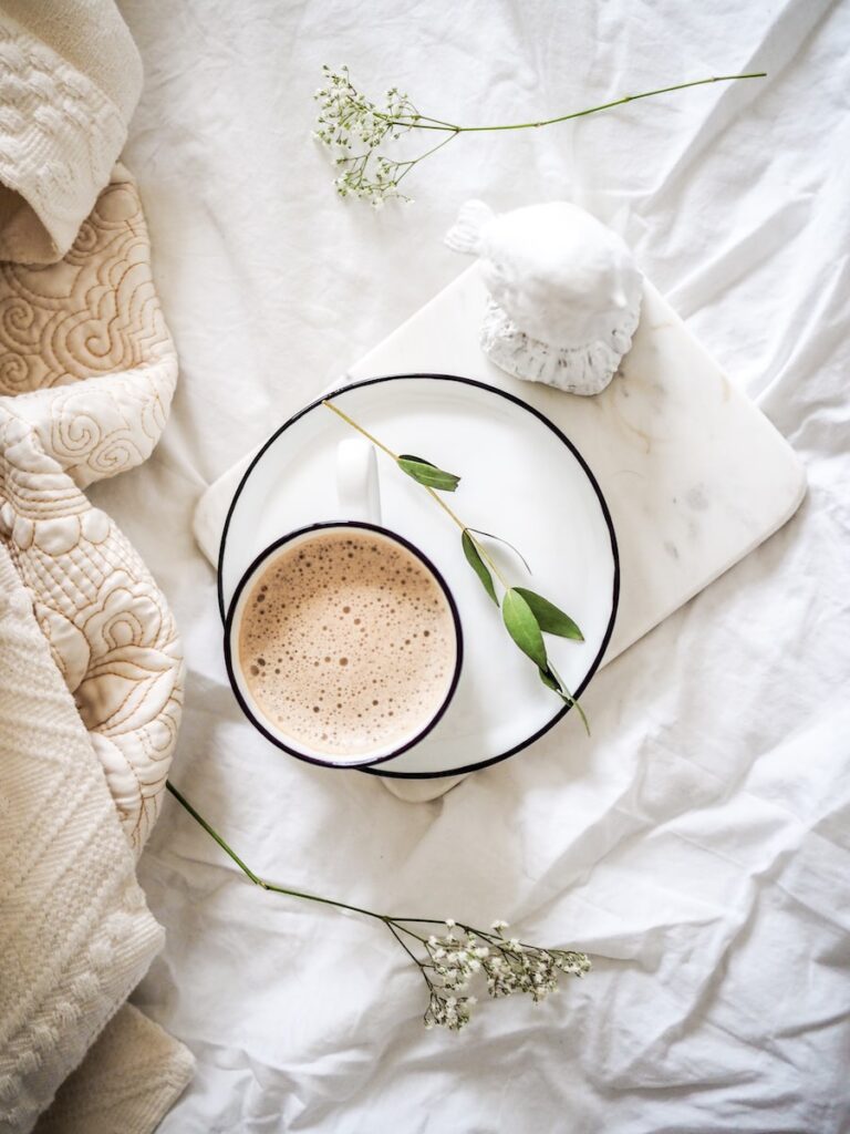 white teacup filled with coffee